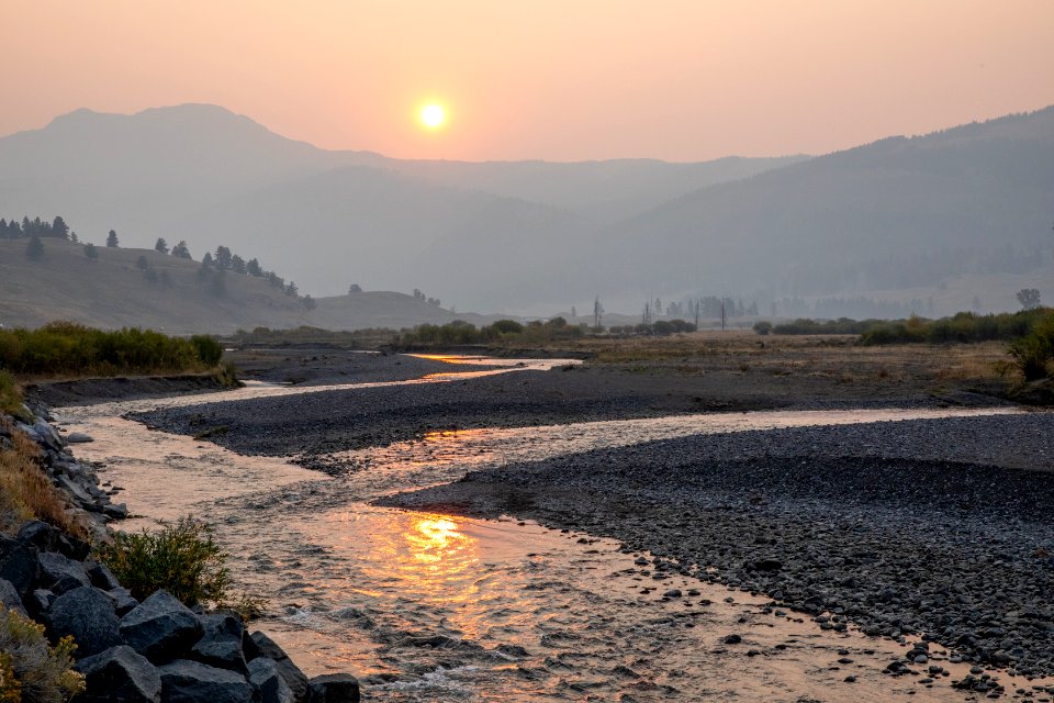 Smoky sunrise over confluence of Lamar River and Soda Butte Creek