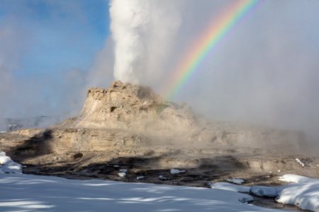 Winter solstice Castle Geyser eruption with rainbow photo