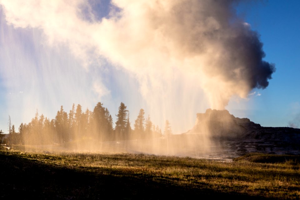 Castle Geyser eruption during the sunset