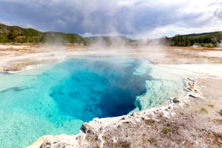 Sapphire Pool steams on a stormy morning