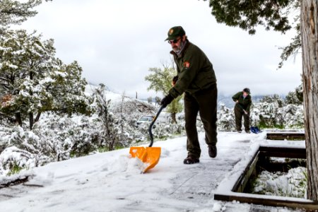 Shoveling snow in Mammoth Campground after a spring snowstorm photo