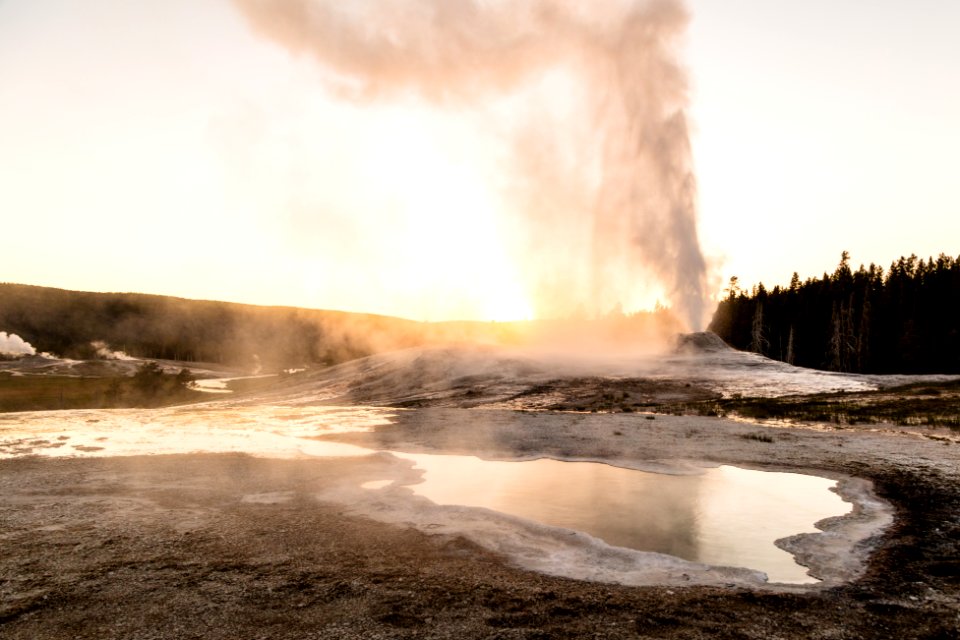 Lion Geyser erupting during sunset