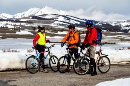 Spring biking with bear spray, resting in a pullout near Swan Lake