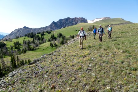 Hikers descending the norht side route of Electric Peak