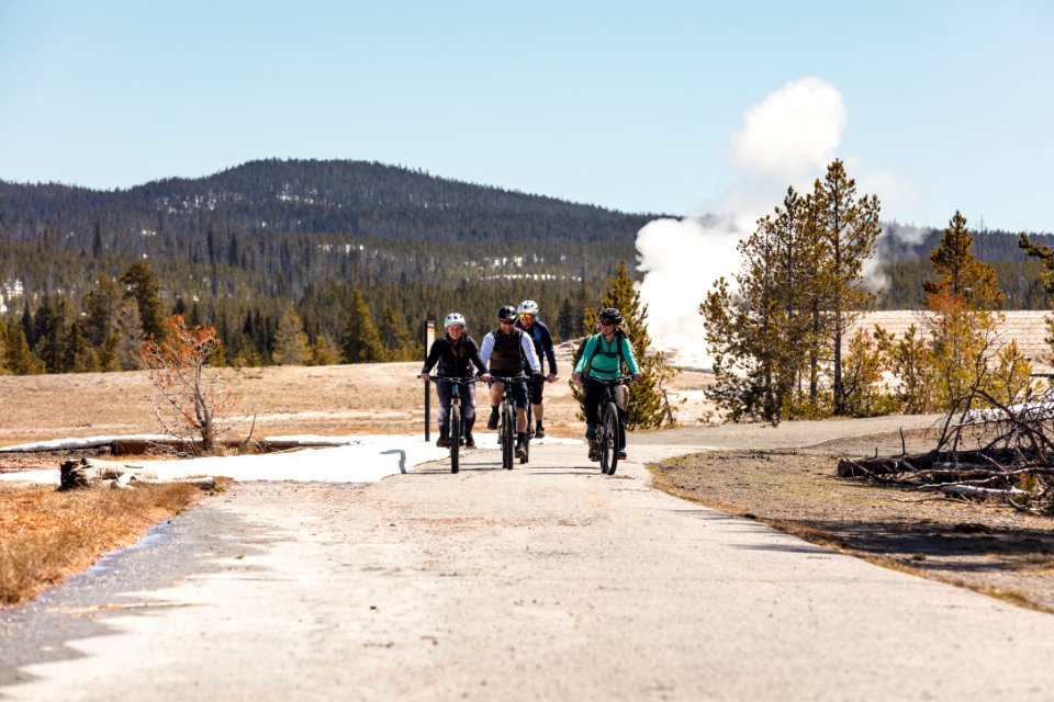 Group of cyclists at Old Faithful