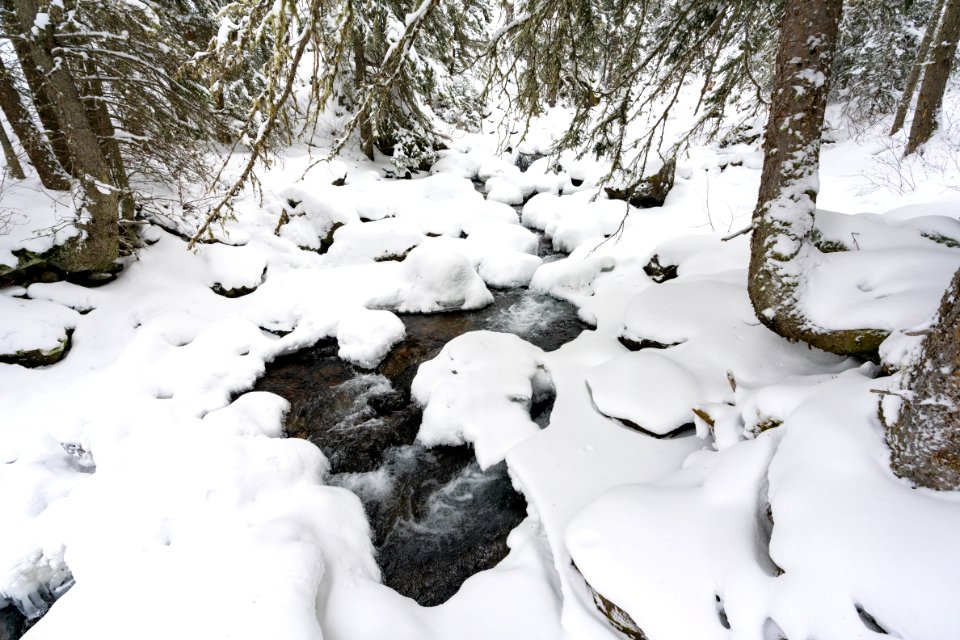 Snowy rocks and cascades of Emigrant Creek