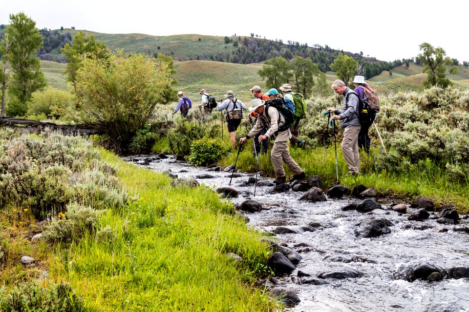 Hikers crossing Rose Creek