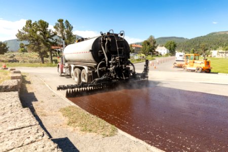 Asphalt distributor laying down a fresh coat