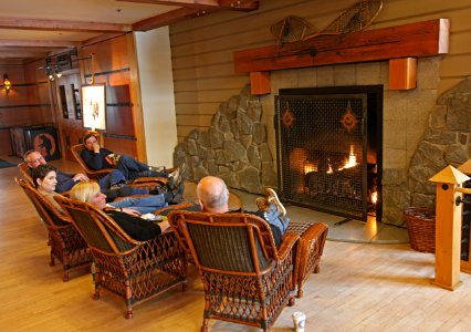Visitors by the fireplace at Old Faithful Snow Lodge photo