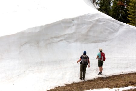 Hikers inspect a cornice on Bison Peak photo