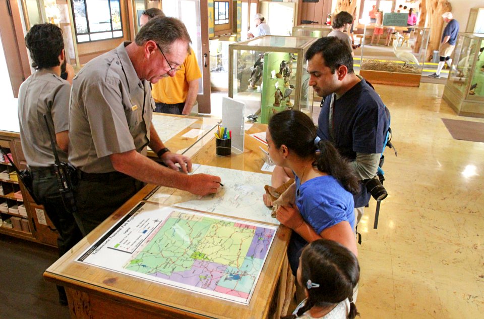 Park Service Ranger helping visitors