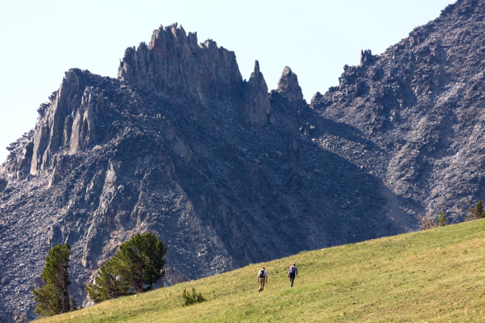Hikers ascending the north side of Electric Peak
