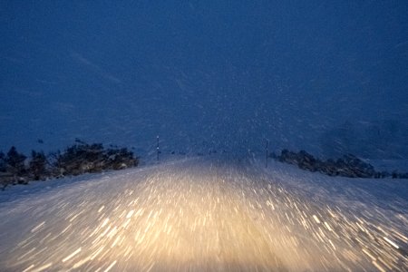 Winter storm night driving conditions photo