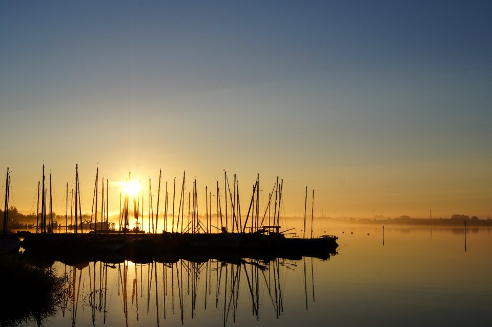 Sail masts sky sea photo