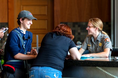 Ranger Chelsea answers questions at Old Faithful Visitor Education Center