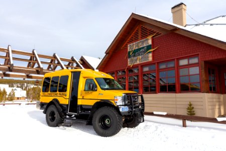 Snowcoach in front of Snow Lodge
