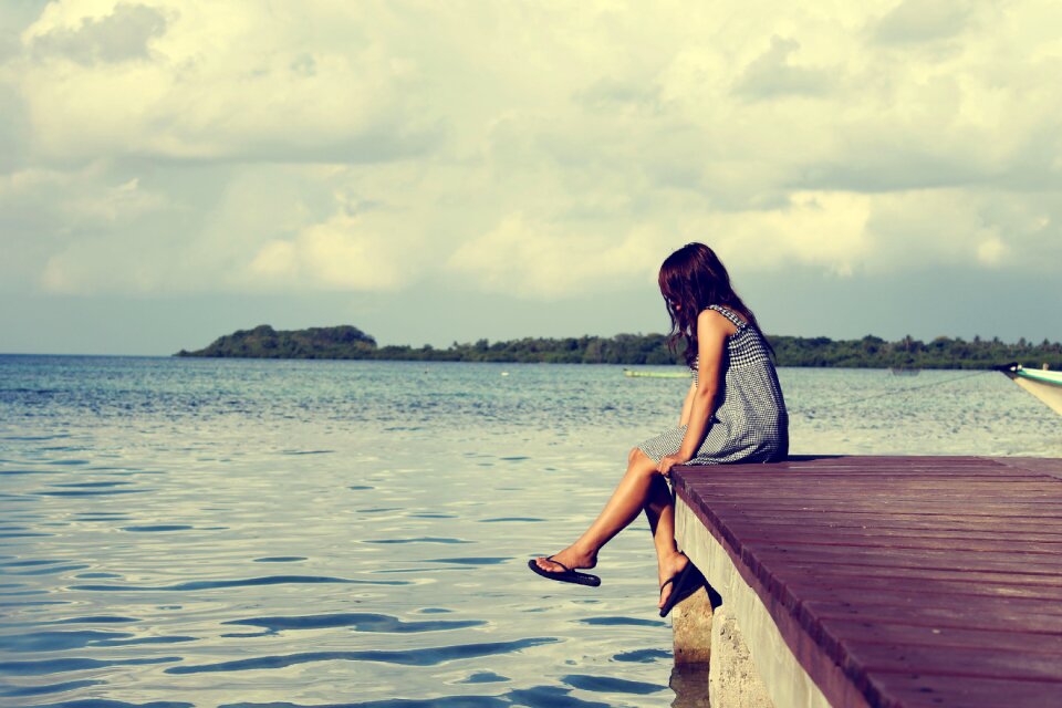 Alone woman sitting lonely