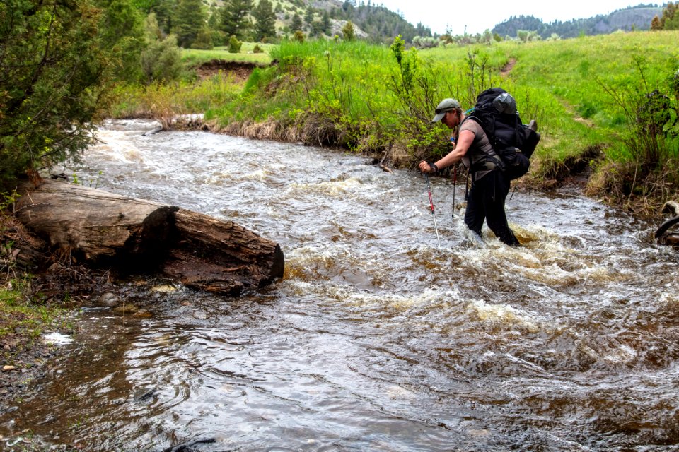 Backpacker crossing Little Cottonwood Creek (2)