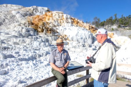 Dan Wenk chats with people near Palette Springs photo