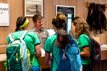 Ranger Brice answers questions at Grant Village Visitor Center photo