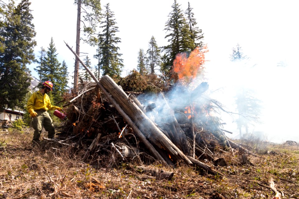 Northeast Entrance fuels project - using a drip torch to burn piles