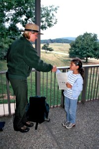Ranger congratulating new Jr. Ranger