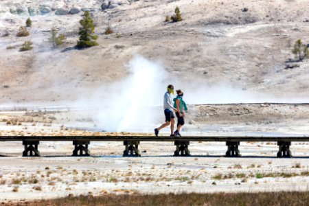 People walk past Constant Geyser