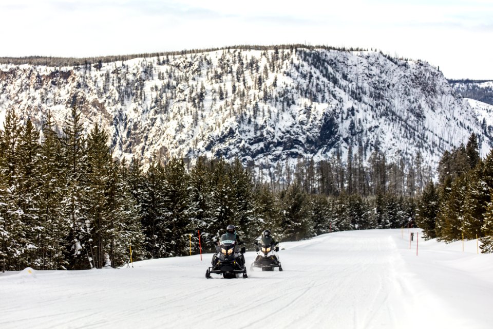 Snowmobilers and National Park Mountain