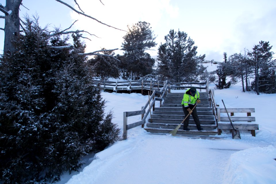 Park Employee clearing snow at Mammoth Terraces