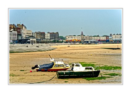 Margate harbour and sea front at low tide. photo
