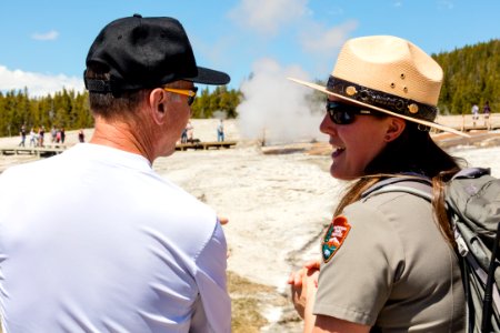 Ranger Annie answering questions near Beehive Geyser