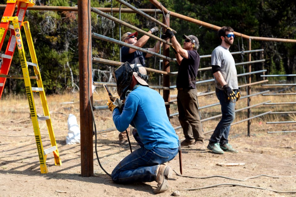 Canyon Corral volunteer project: tacking fencing into place
