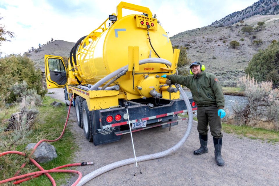 Engineer Equipment Operator Tony Aiuppa and the pumper truck aka "honeywagon"