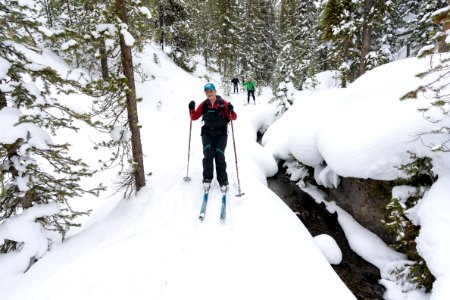 Skiers enter the canyon along the Spring Creek Trail