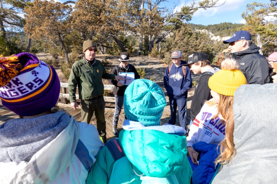 Ranger Mike talks about early visitation to the park with a school group
