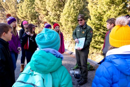 Ranger Mike talks about the Yellowstone Caldera with a school group photo