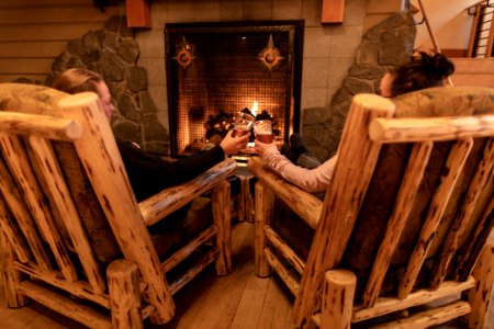 Drinks by the fire at Old Faithful Snow Lodge