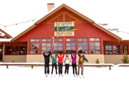 Skier group photo in front of Snow Lodge photo