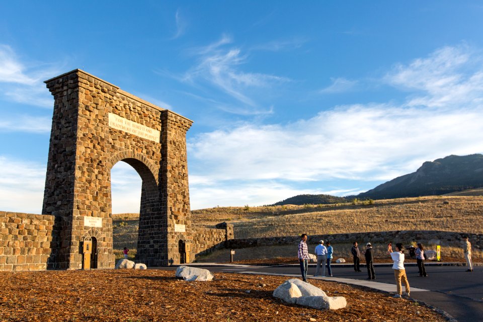 People taking pictures at Roosevelt Arch