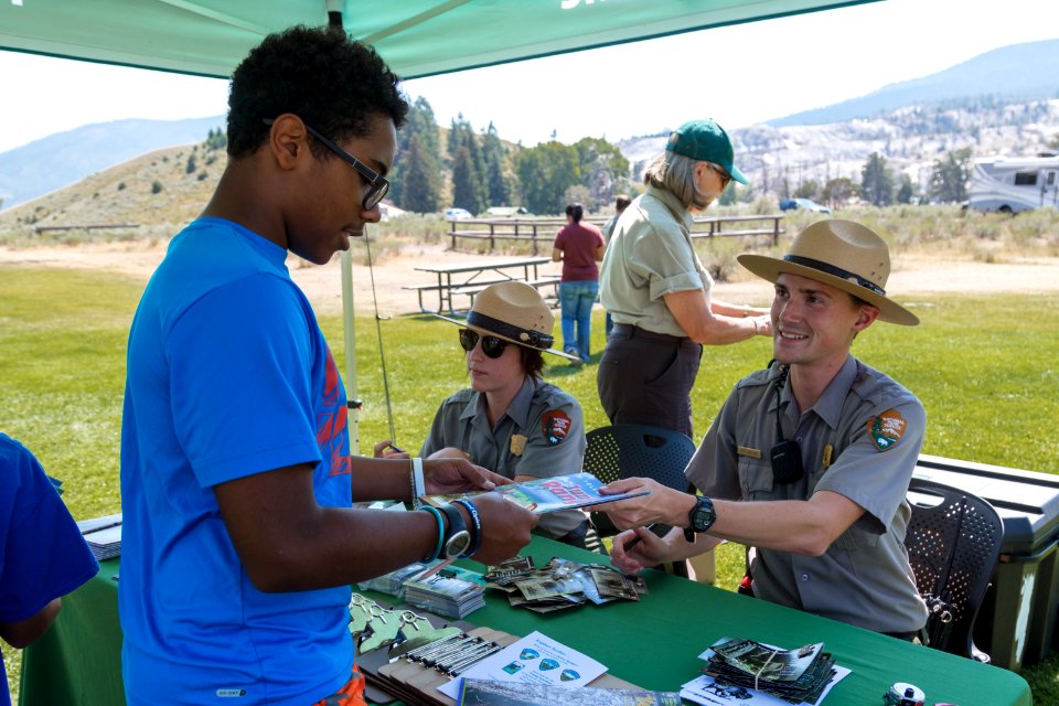 Ranger Jeff hands back a signed Junior Ranger booklet