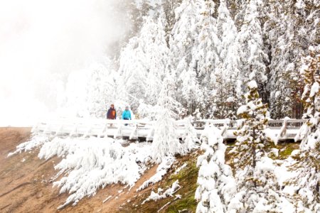 Exploring along a rime ice-covered boardwalk in Porcelain Basin photo