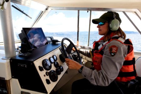 Ranger Sene captains her boat on Yellowstone Lake photo