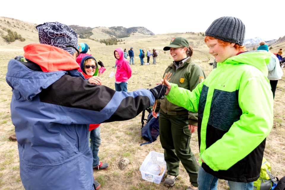 Expedition Yellowstone group playing "Guessing Sticks," a Chippewa game