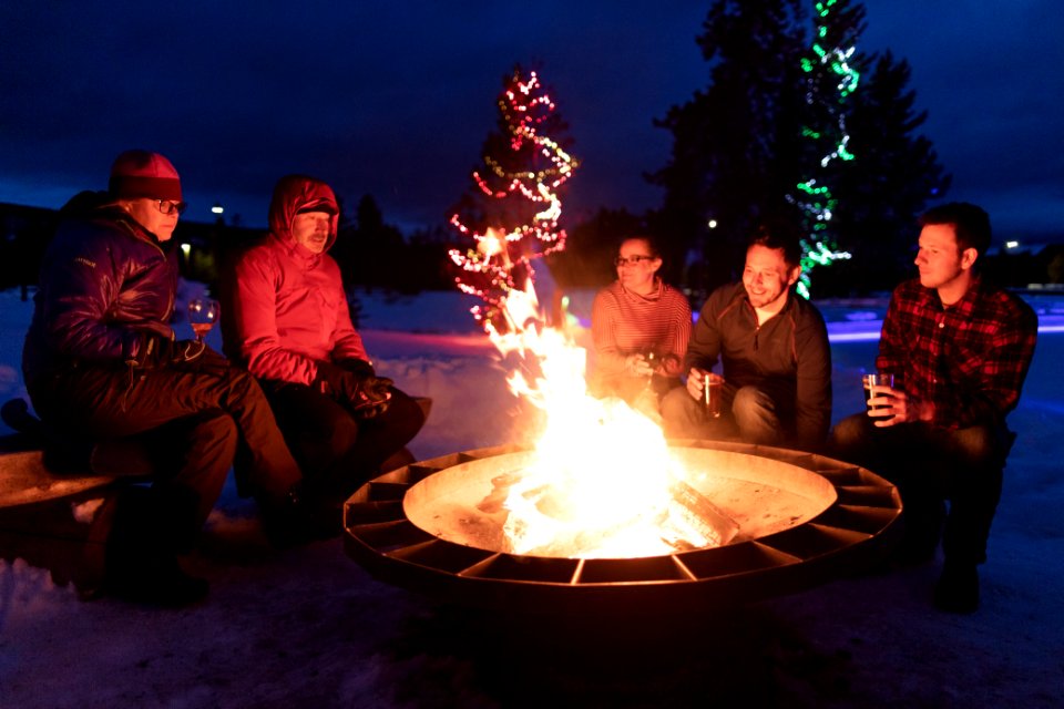Drinks by the fire pit at Snow Lodge