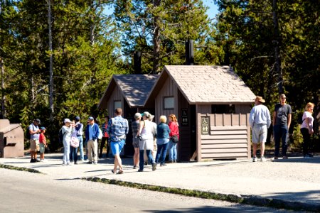 People waiting to use the restroom at Midway Geyser Basin parking area