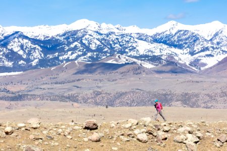 A hiker with the Gallatin Range in the distance photo