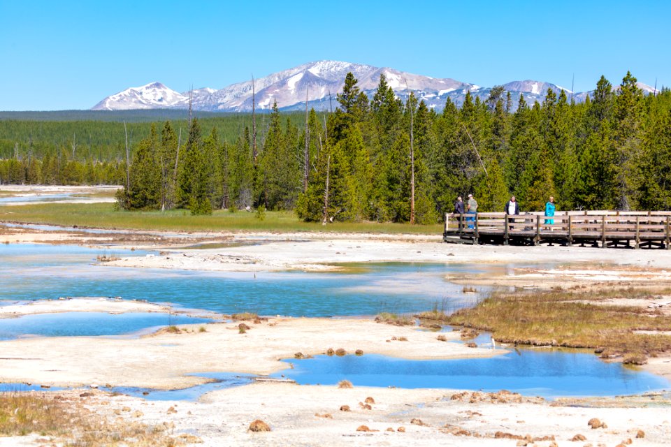 People take in the view of Crackling Lake from the boarkwalk