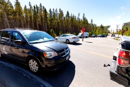 The line to wait for a parking spot at Midway Geyser Basin causes a backup in the turn lane photo