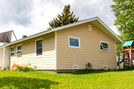 Newly-installed siding on non-historic employee housing