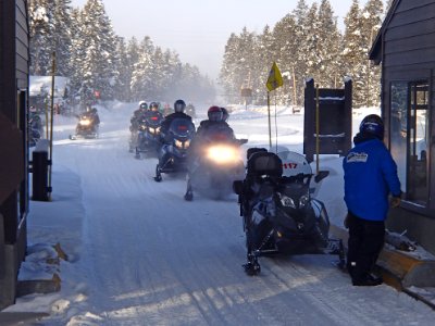 Snowmobiles waiting to enter park